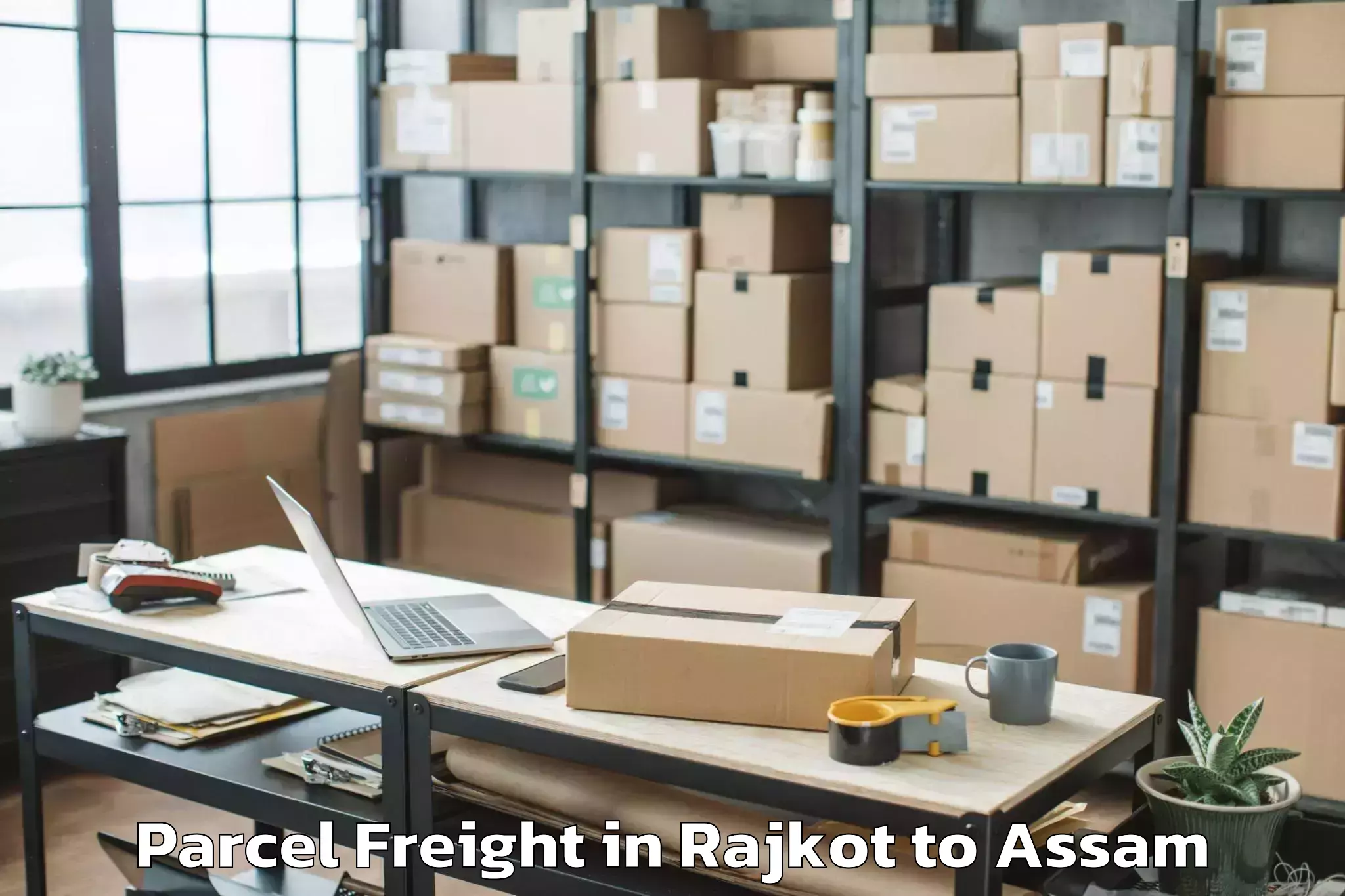 Book Your Rajkot to Hojai Parcel Freight Today